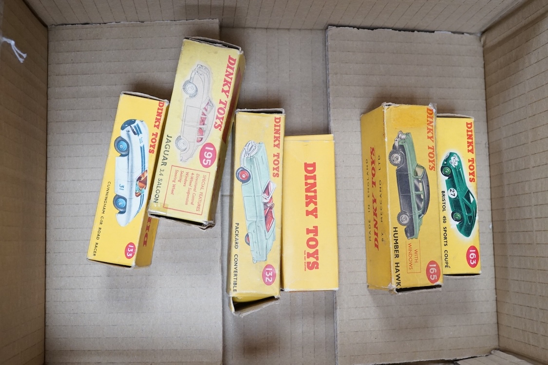 Six boxed Dinky Toys cars; Cunningham C-5R (133), Jaguar 3.4 saloon (195) in grey, Packard convertible (132) in fawn, Jaguar XK120 (157) in dark red (in a reproduction box), Humber Hawk (165) in two-tone green and black,